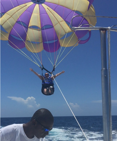 Gina parasailing. Her blindness doesnt stop her for living life to the fullest.